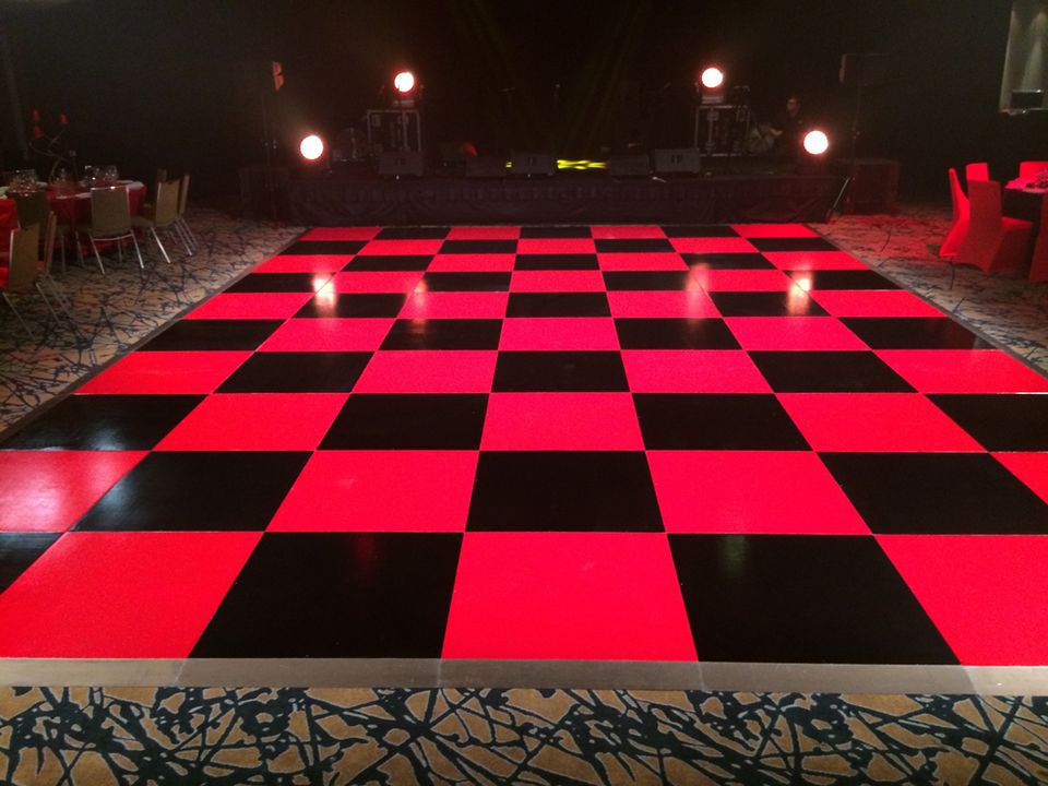 Red and black checkered dance floor at an evening event