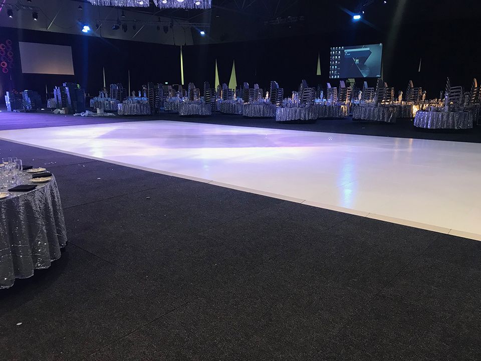 Long white gloss floor laid in a ballroom